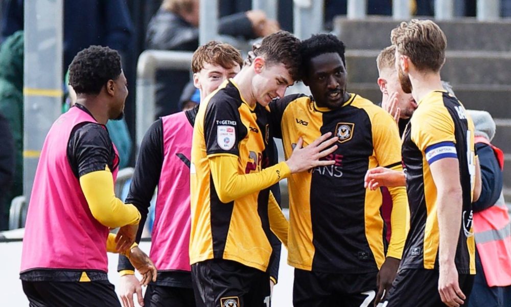 Joe Thomas of Newport County, centre, celebrates his goal with team-mates