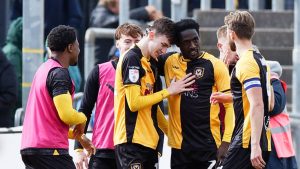 Joe Thomas of Newport County, centre, celebrates his goal with team-mates