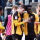 Joe Thomas of Newport County, centre, celebrates his goal with team-mates
