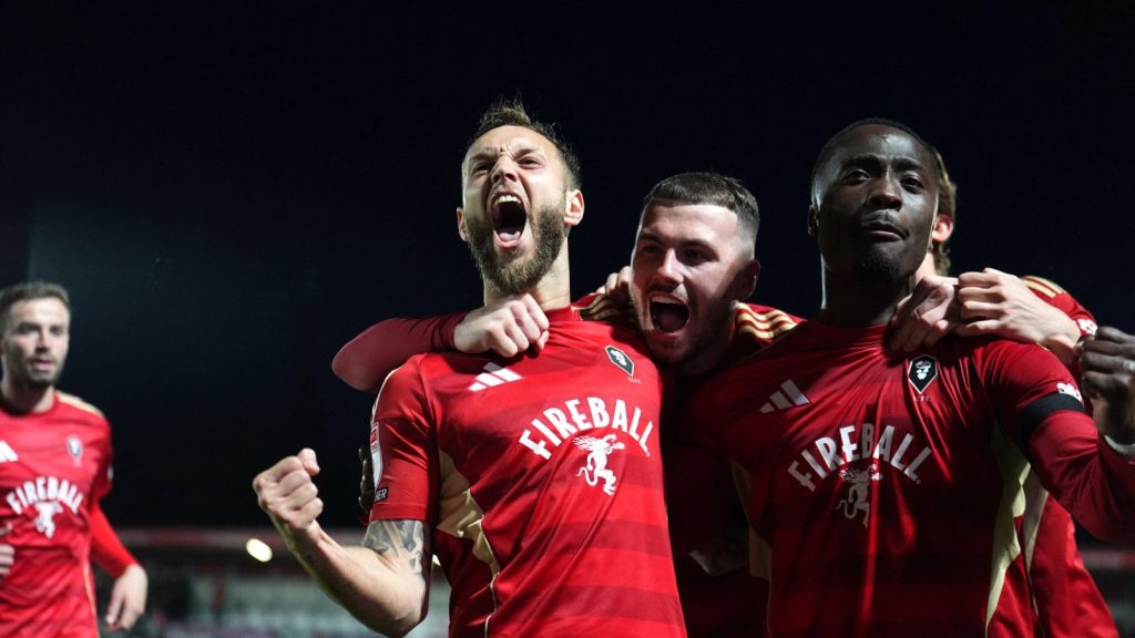 Jorge Grant (left) celebrates scoring Salford City&rsquo;s first goal
