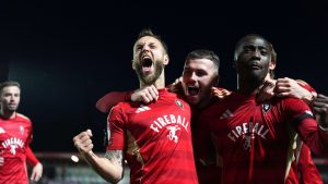 Jorge Grant (left) celebrates scoring Salford City’s first goal