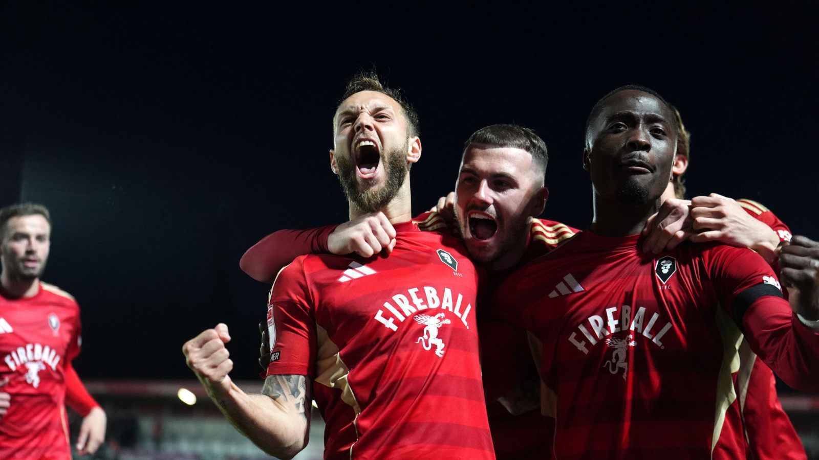 Jorge Grant (left) celebrates scoring Salford City’s first goal