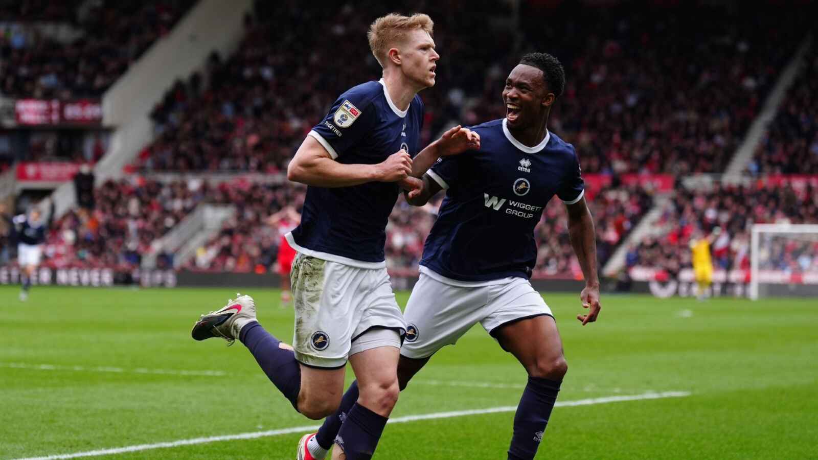 Josh Coburn, left, celebrates his winner for Millwall at former club Middlesbrough