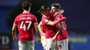 Josh Windass, right, is congratulated after scoring Wrexham’s winner at Oxford United