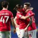 Josh Windass, right, is congratulated after scoring Wrexham’s winner at Oxford United