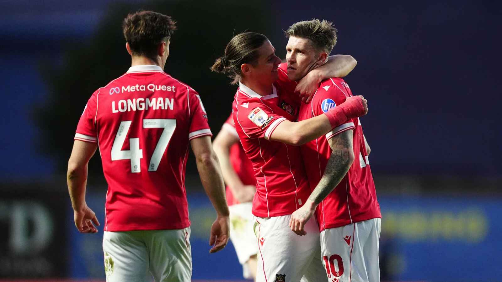 Josh Windass, right, is congratulated after scoring Wrexham’s winner at Oxford United