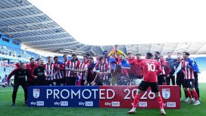 Lincoln City sealed promotion to the Championship with victory at Reading