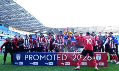 Lincoln City sealed promotion to the Championship with victory at Reading