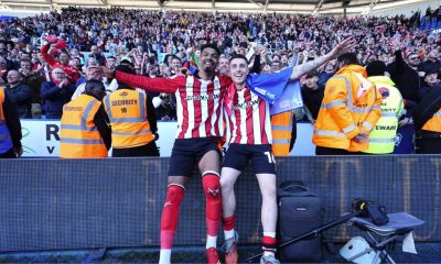 Lincoln City's Reeco Hackett, left, and Dom Jefferies celebrate promotion