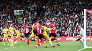 Ryan One, partly obscured, is about to score Lincoln City’s winner