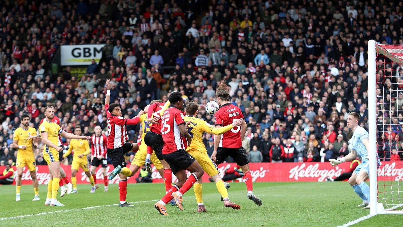 Ryan One, partly obscured, is about to score Lincoln City’s winner