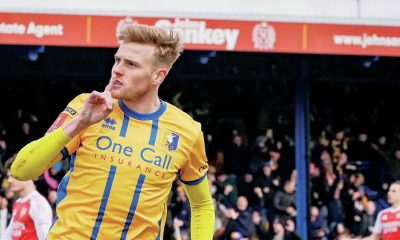 Will Evans celebrates his equaliser for Mansfield Town against Arsenal in the FA Cup