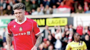 Josh Windass wheels away after scoring Wrexham’s second