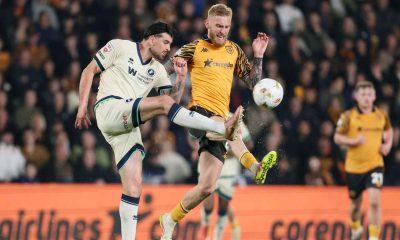 Millwall’s Tristan Crama (left) and Hull City’s Oli McBurnie battle for the ball