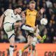 Millwall’s Tristan Crama (left) and Hull City’s Oli McBurnie battle for the ball