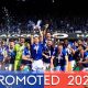 Skipper Dara O’Shea lifts the trophy as Ipswich Town savour promotion
