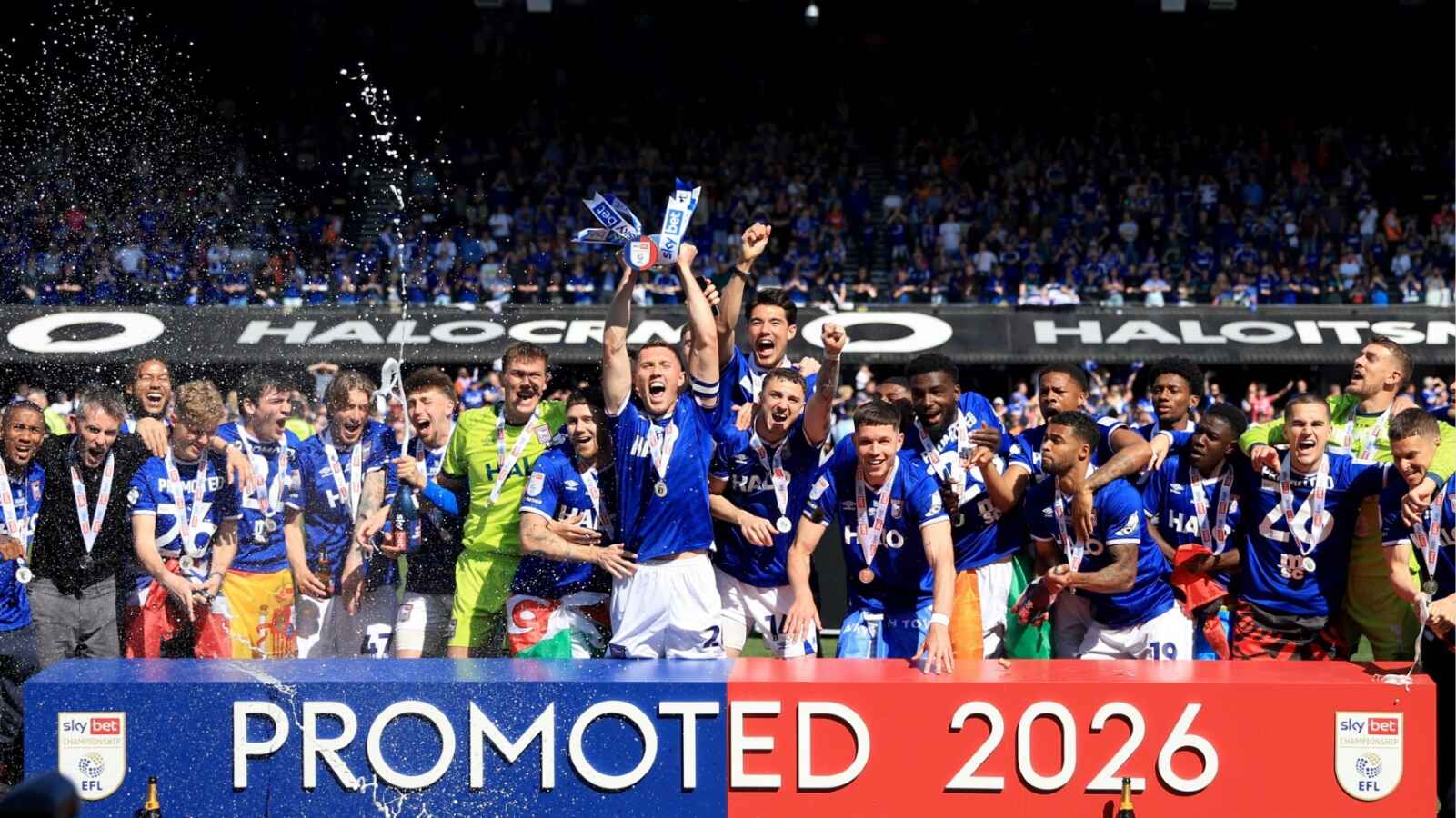 Skipper Dara O’Shea lifts the trophy as Ipswich Town savour promotion