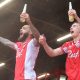 Crawley Town’s Jay Williams, left, and Jonny Russell celebrate staying up