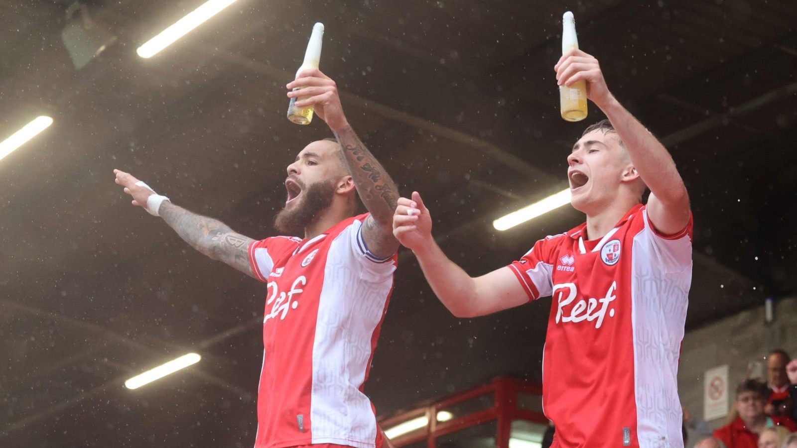 Crawley Town’s Jay Williams, left, and Jonny Russell celebrate staying up