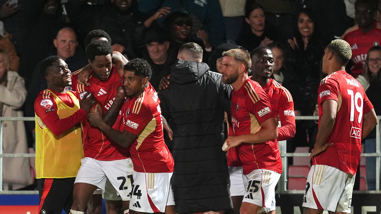Salford City’s Kallum Cesay (second left) celebrates scoring against Grimsby Town