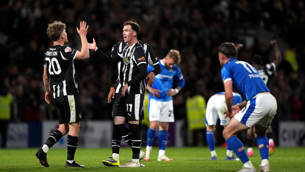 Scott Robertson and Conor Grant celebrate victory for Notts County