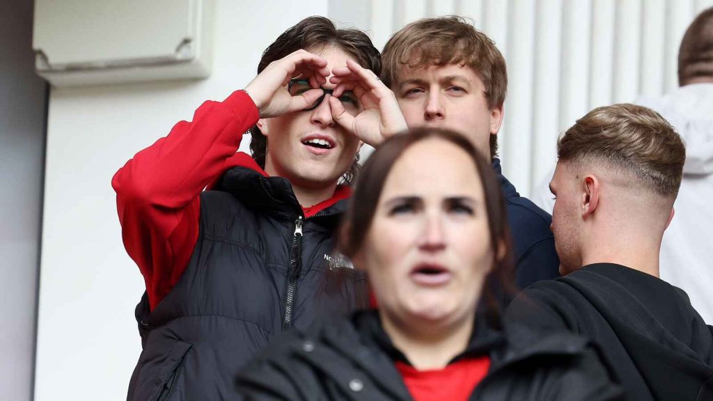 A Middlesbrough fan makes a binoculars gesture during the Championship play-off match against Southampton