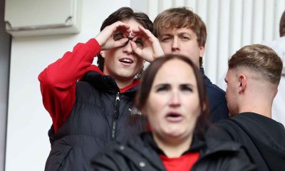 A Middlesbrough fan makes a binoculars gesture during the Championship play-off match against Southampton