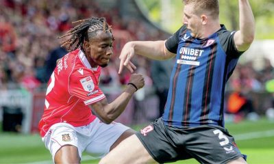 Wrexham’s Issa Kabore, left, is challenged by Middlesbrough’s Matt Targett