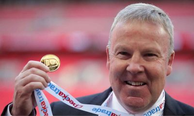 Kenny Jackett holds up his medal after winning the Checkatrade Trophy with Portsmouth