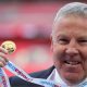 Kenny Jackett holds up his medal after winning the Checkatrade Trophy with Portsmouth