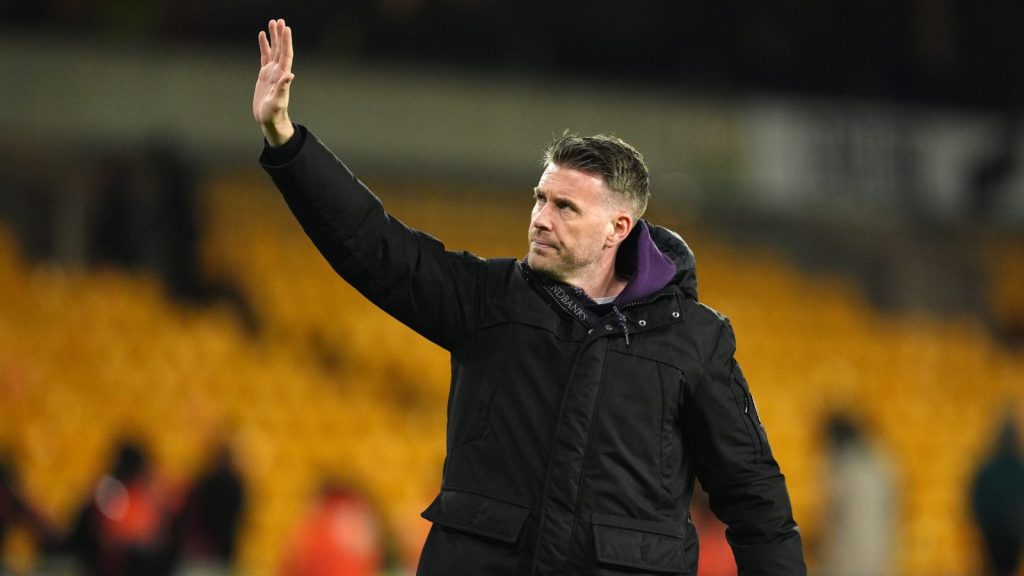 Rob Edwards waves to the Wolves fans