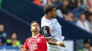 Bolton Wanderers’ Akin Famewo heads clear under pressure