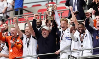 Bromley manager Andy Woodman, centre, celebrates promotion into the EFL in 2024