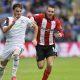Bolton Wanderers’ Max Conway is chased by Lincoln City’s Dominic Jefferies