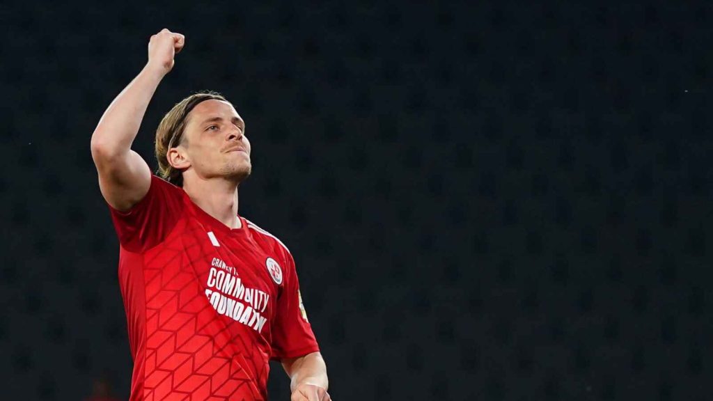 Danilo Orsi celebrates a goal for Crawley Town