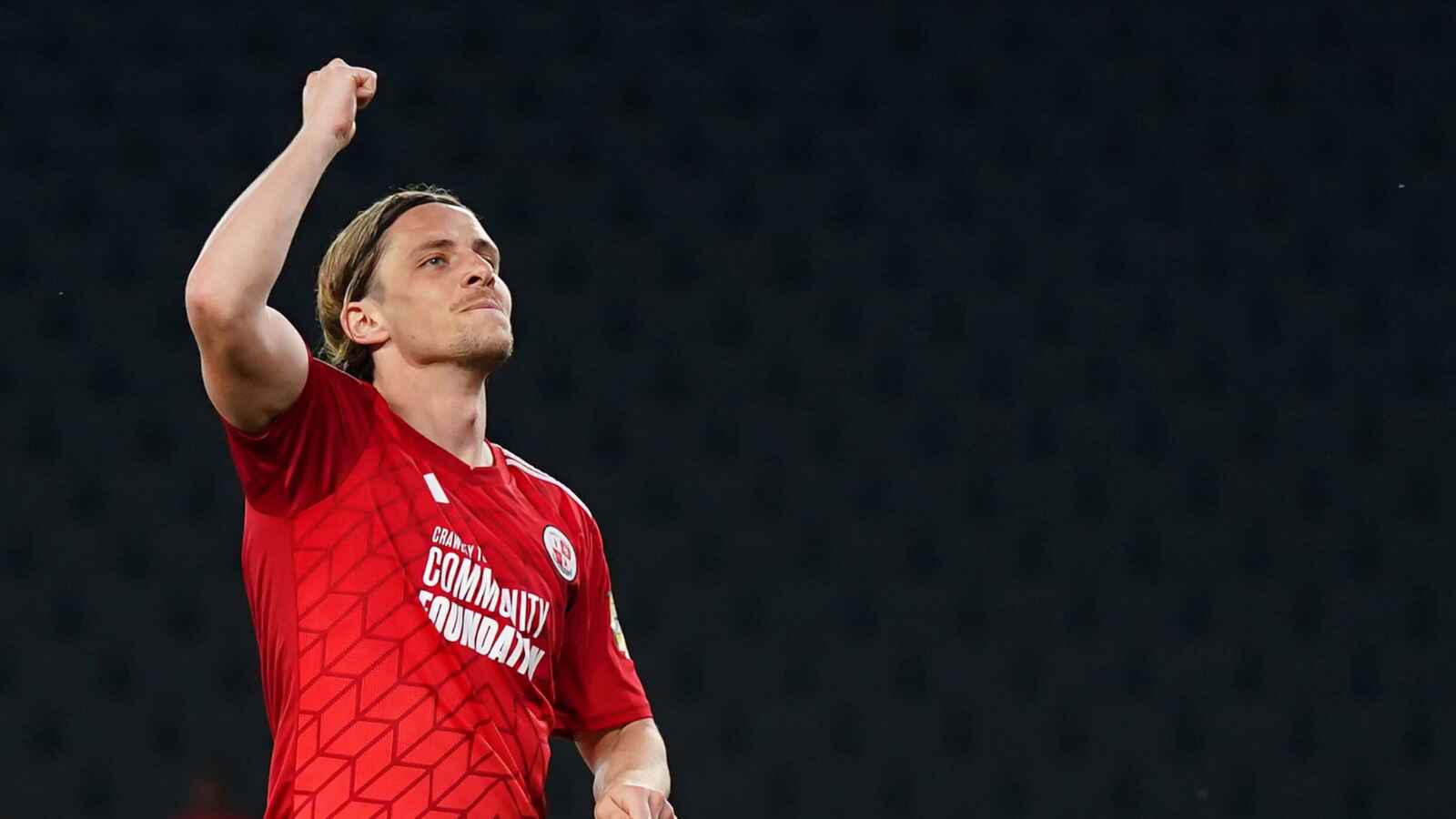 Danilo Orsi celebrates a goal for Crawley Town