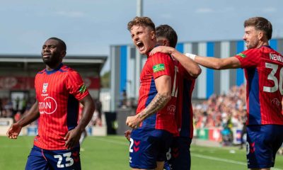 Harry Boyes celebrates his first York City goal with Alex Newby, right and Joe Felix, left.