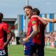 Harry Boyes celebrates his first York City goal with Alex Newby, right and Joe Felix, left.