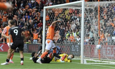 Blackpool’s Jerry Yates pokes past Peterborough United’s Alex Bass to make it 4-0