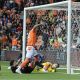 Blackpool’s Jerry Yates pokes past Peterborough United’s Alex Bass to make it 4-0