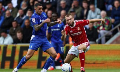 Oldham Athletic’s Oliver Norburn, left, battles with Swindon Town’s Aaron Drinan