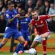 Oldham Athletic’s Oliver Norburn, left, battles with Swindon Town’s Aaron Drinan