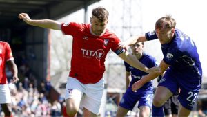 Ollie Pearce, left, in action for York City in last season’s title decider at Rochdale.