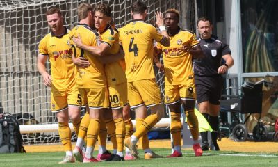 Newport County celebrate their second, scored by Shaquille Gwengwe, right