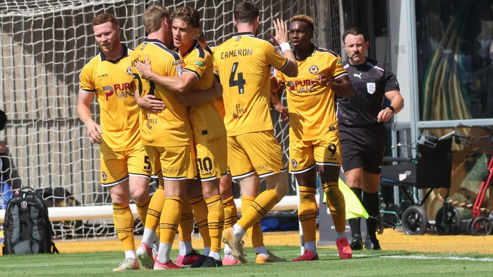 Newport County celebrate their second, scored by Shaquille Gwengwe, right