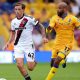 Sheffield United’s Sydie Peck, left, takes on Mansfield Town veteran David McGoldrick in the Carabao Cup.