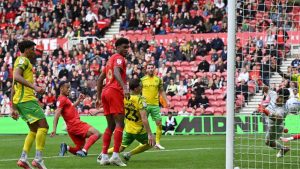 Ashley Phillips, left, scores Middlesbrough’s late winner against Norwich City.