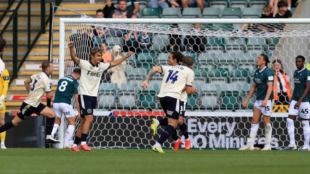 Burton Albion celebrate Jack Armer’s, left, winner against Plymouth Argyle