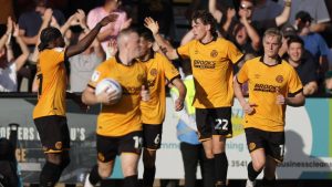 Cambridge United’s Zak Bradshaw, second right, is congratulated on his late leveller.