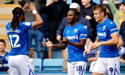 Gillingham’s Sheldon Kendall, centre, takes the congratulations.